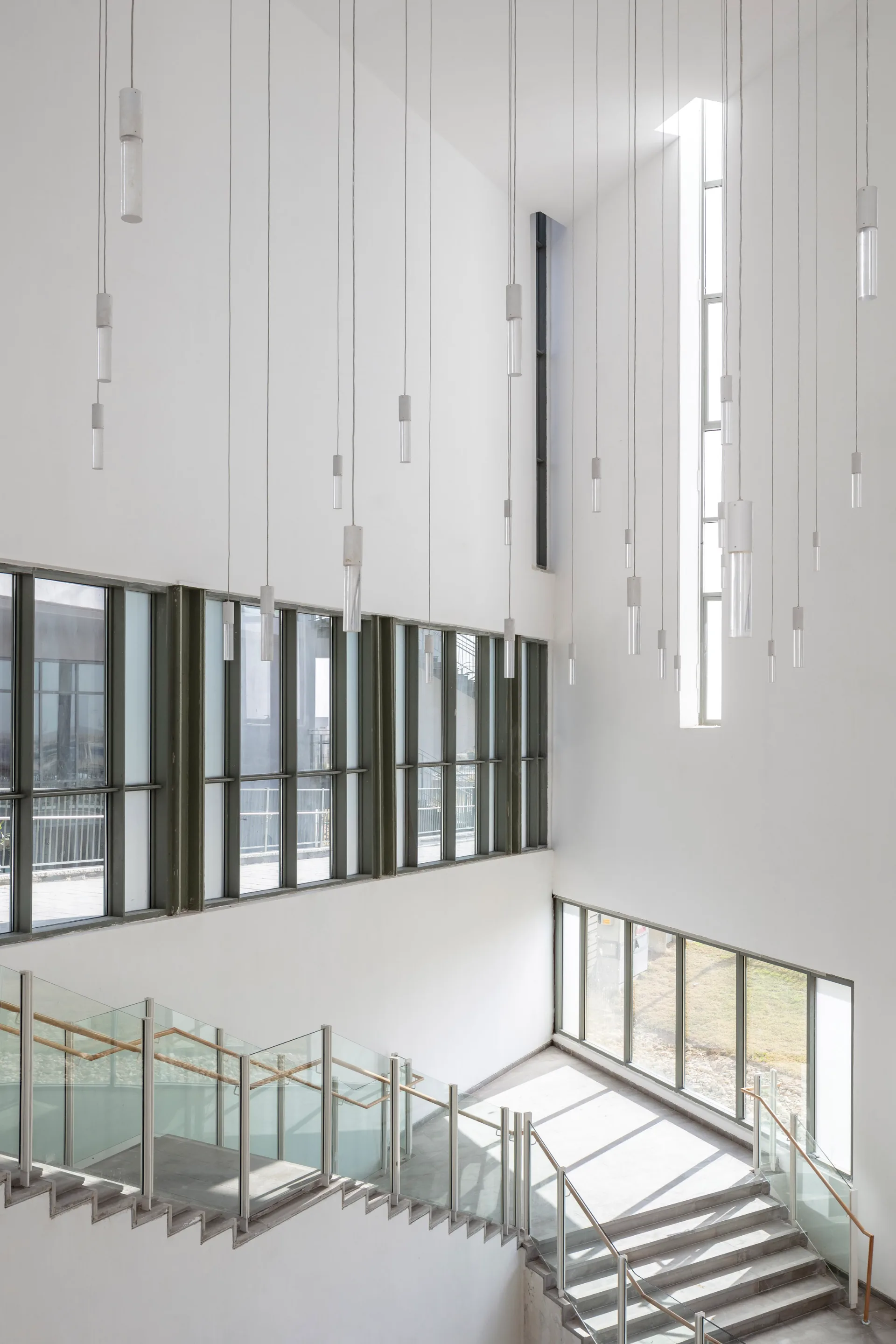 The atrium with suspended pendant fixtures