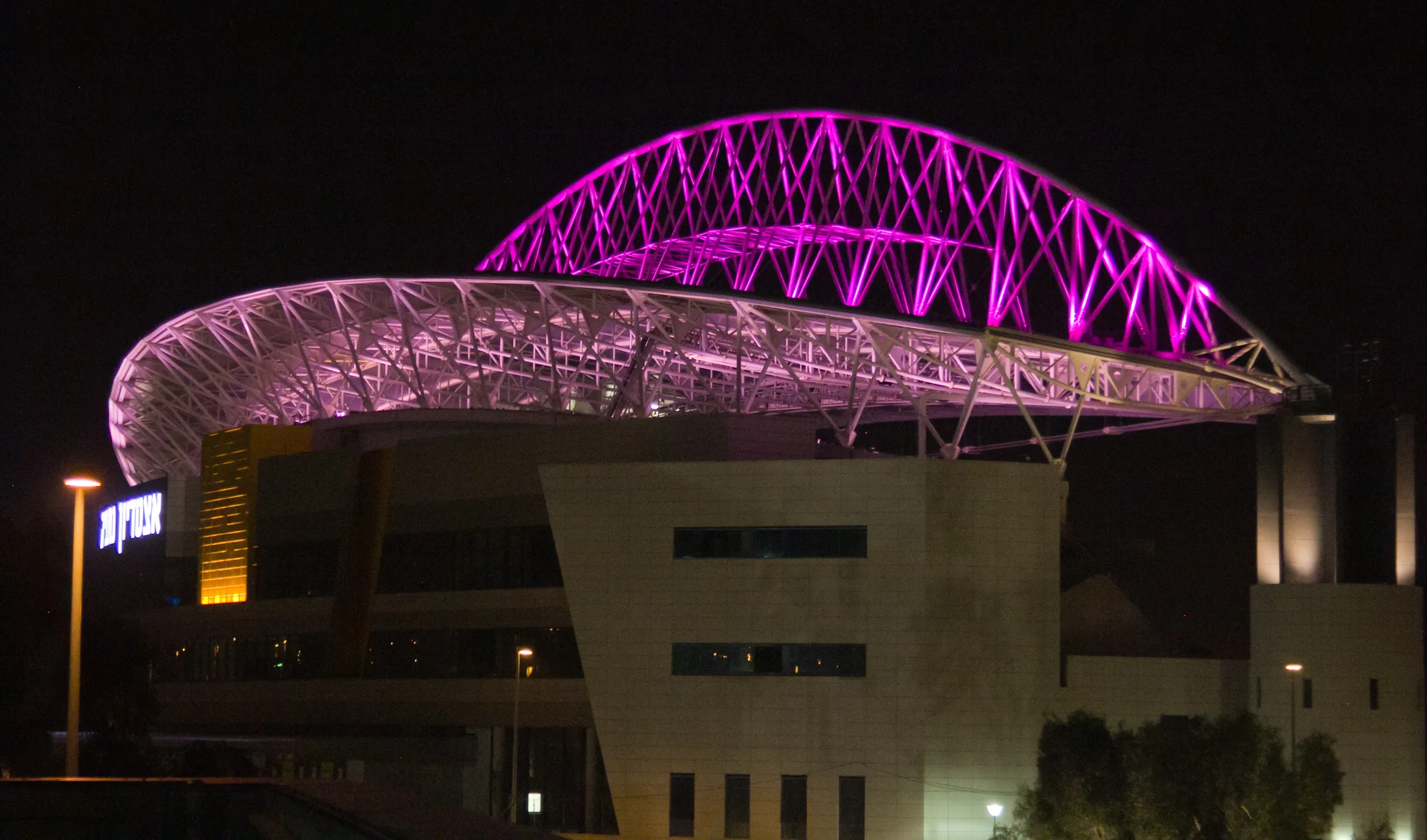 Netanya Stadium in pink lighting