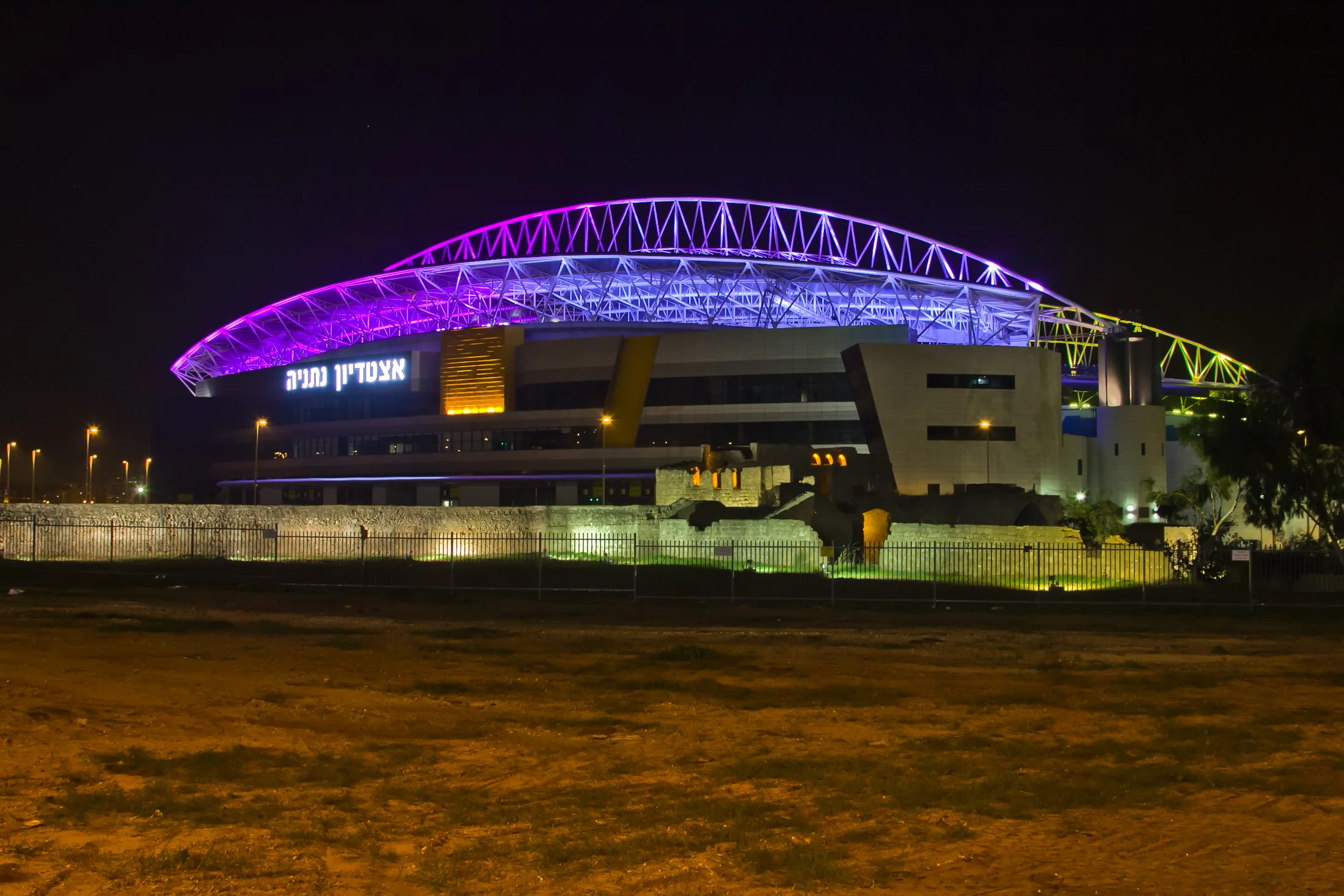 Netanya Stadium in evening lighting