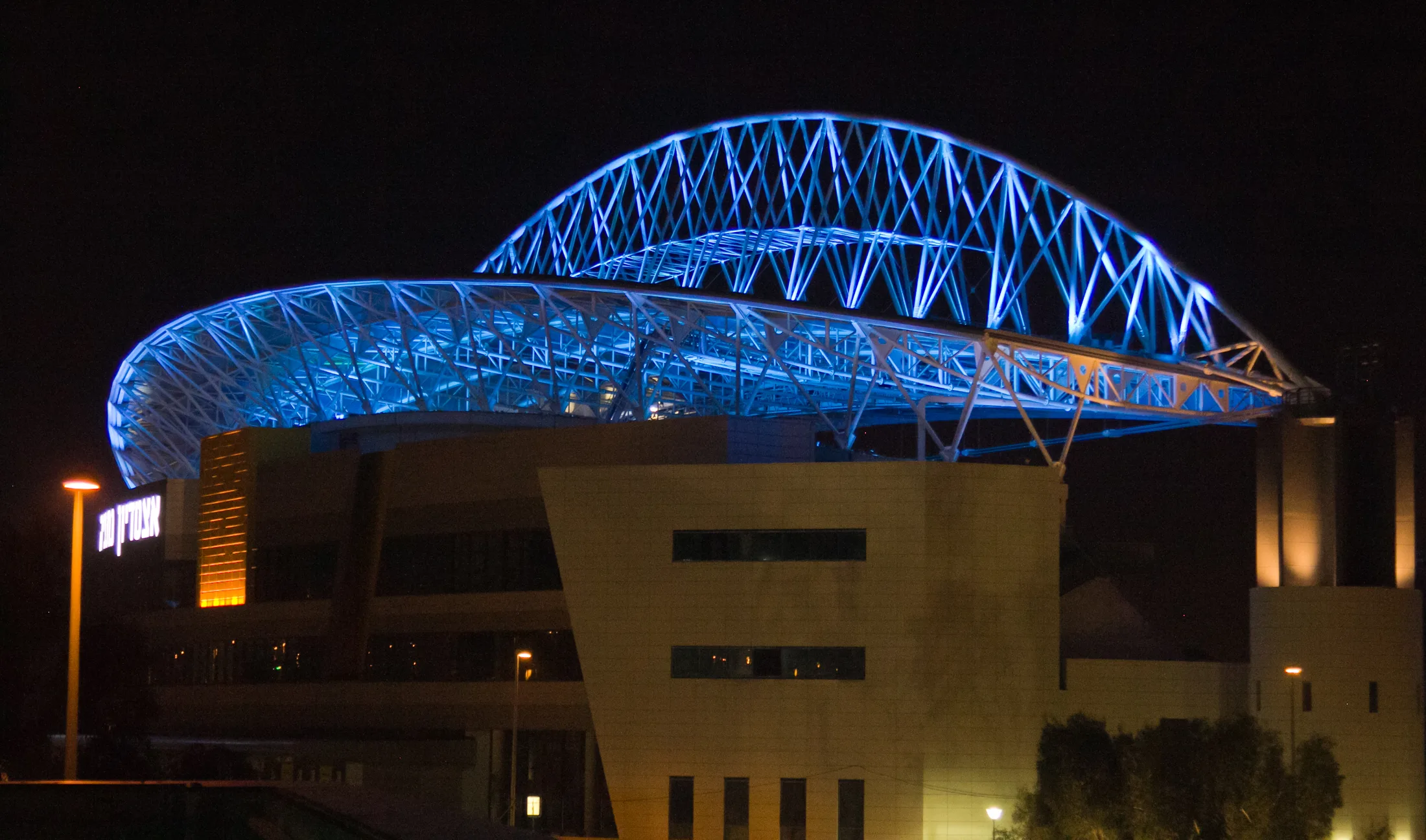 Netanya Stadium in blue lighting