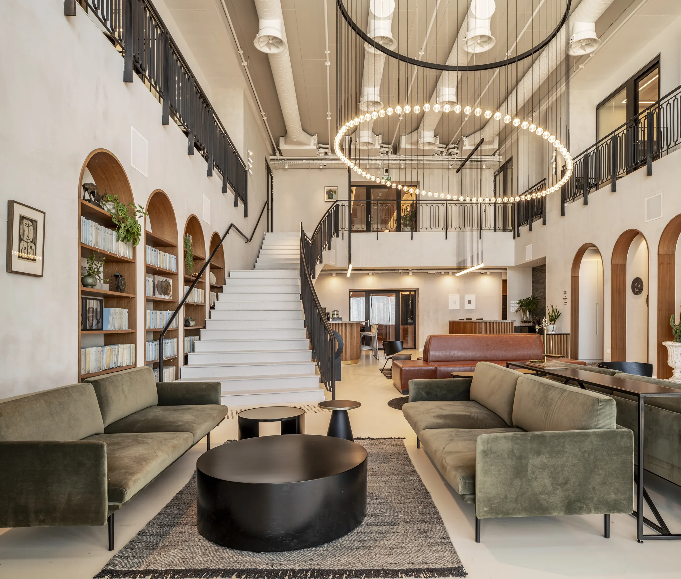 Lounge seating beneath the suspended ring of bulbs