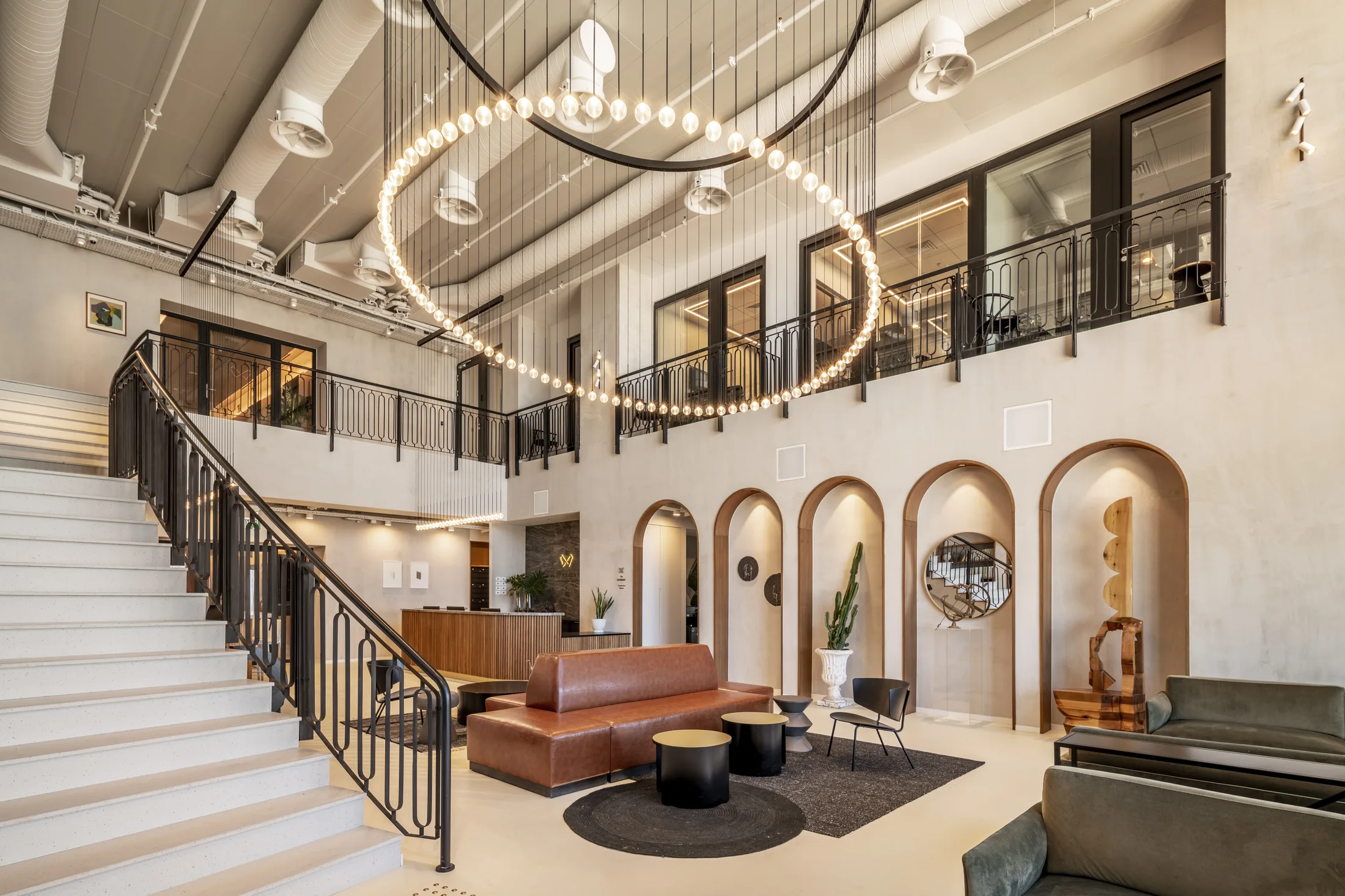 The reception and arched niches under the ring chandelier