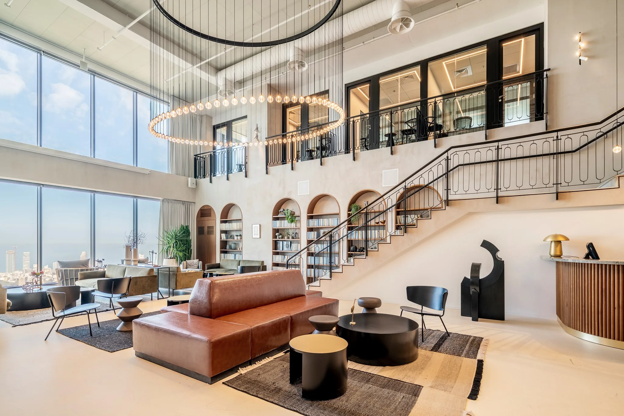 The business lounge, reception, and staircase by the windows