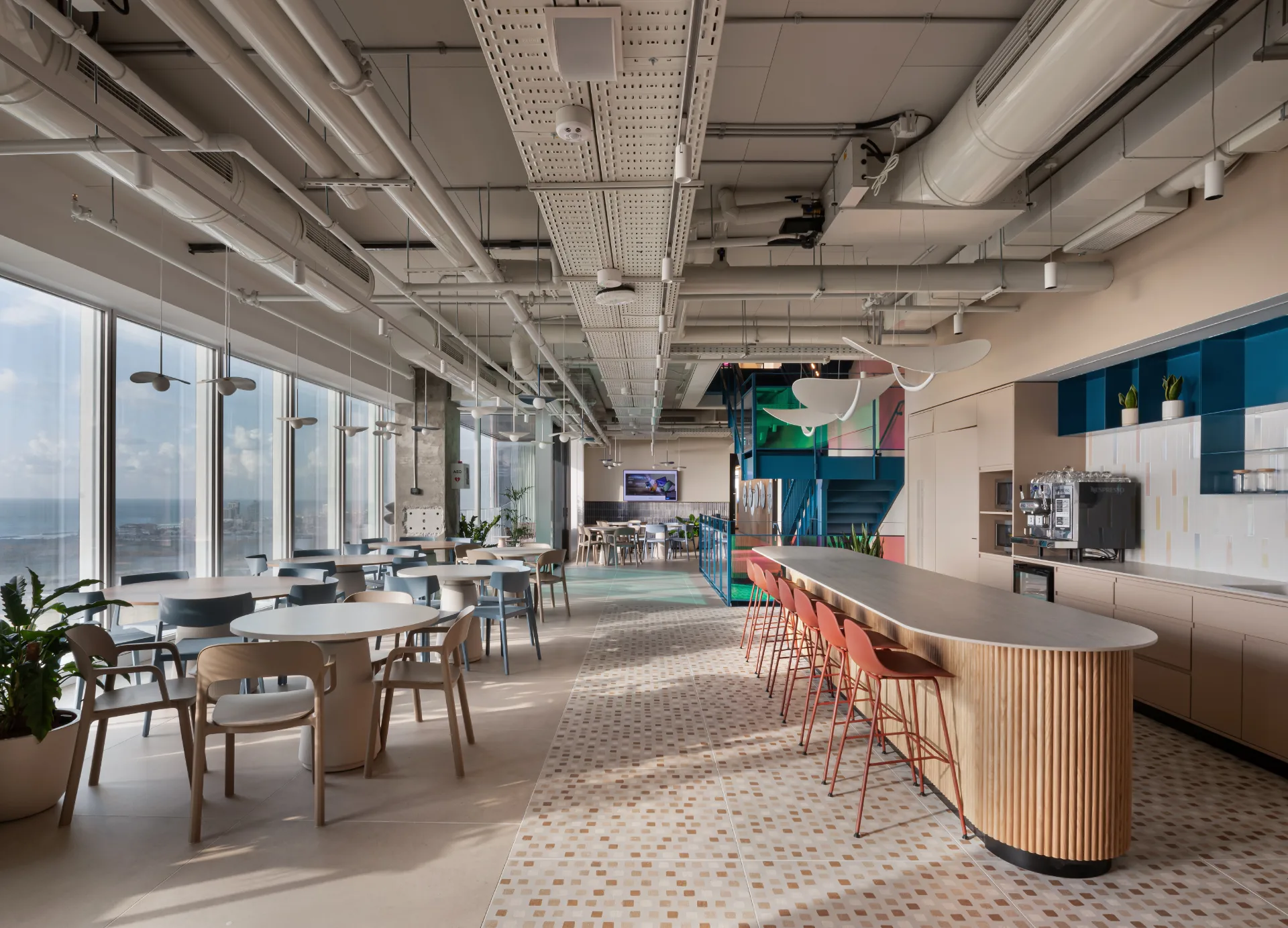 Cafeteria with disc fixtures and the blue stair