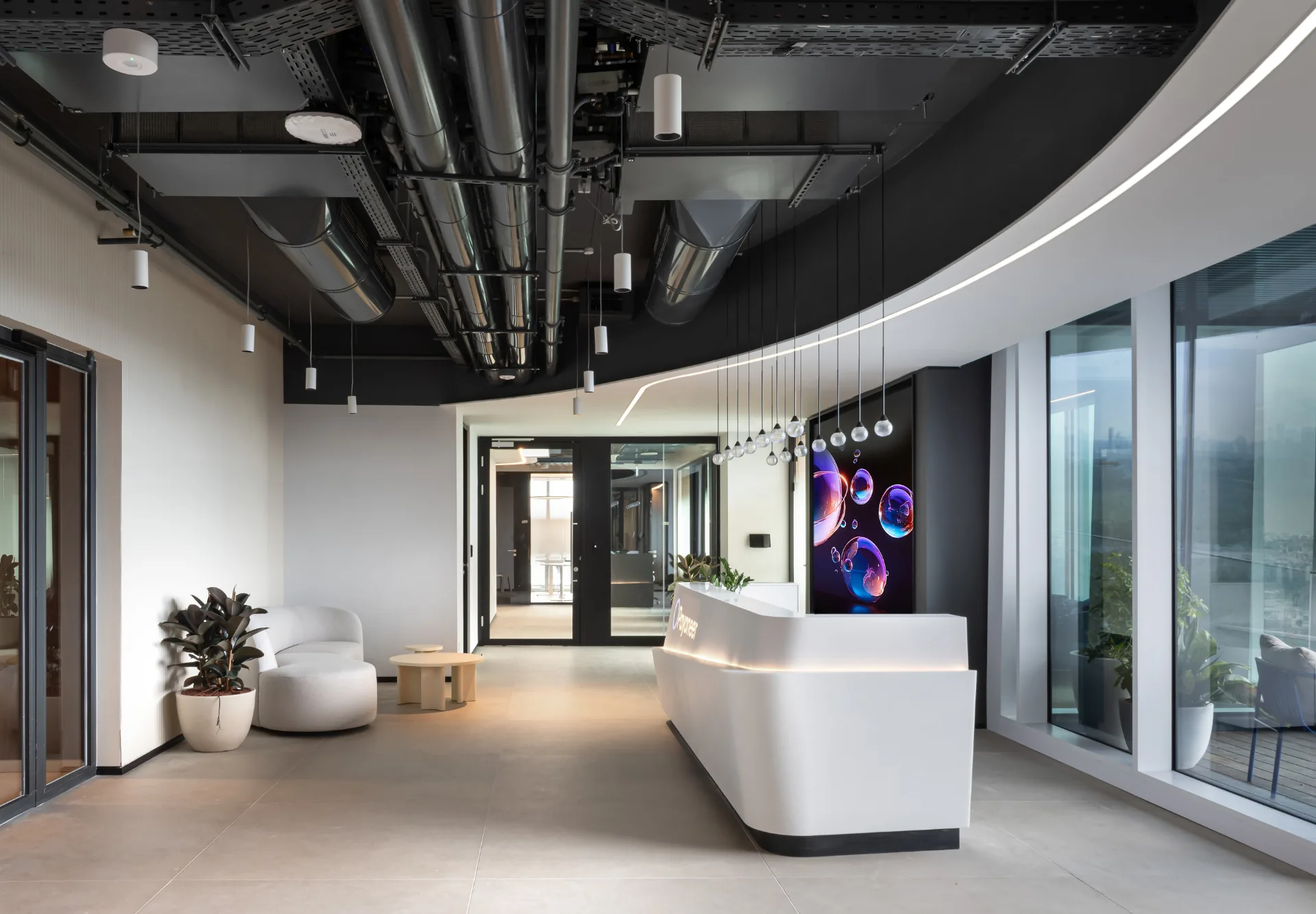 Lobby with a pendant cluster and lounge seating