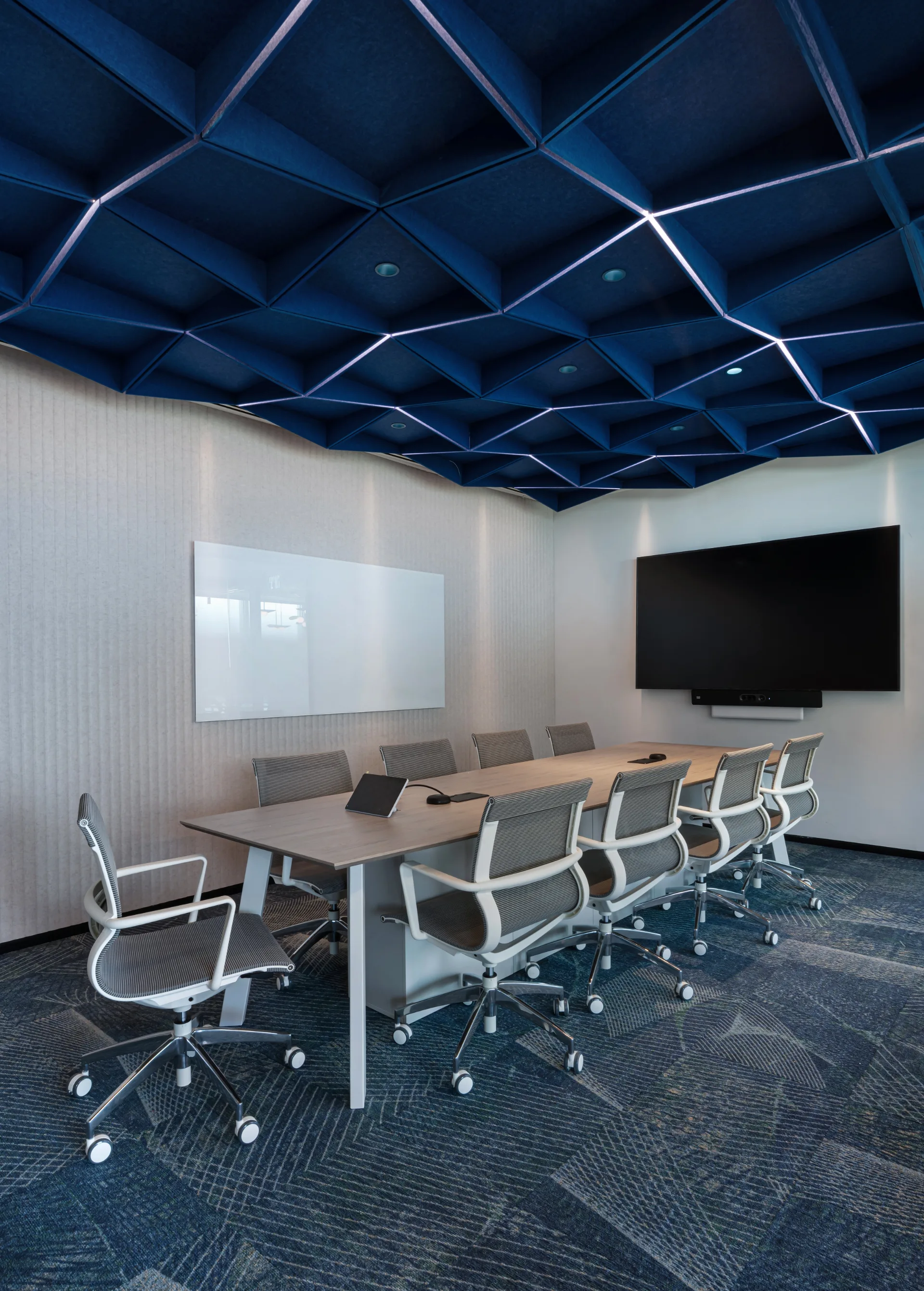 Meeting room beneath an illuminated blue felt ceiling