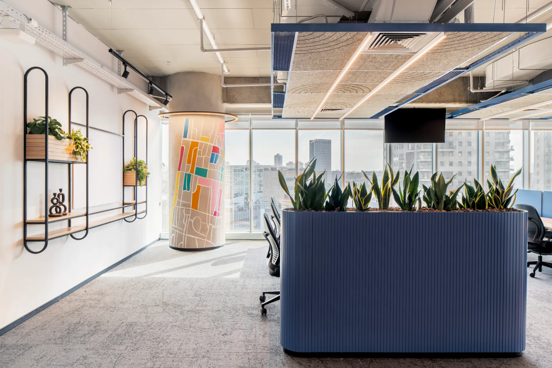 Work corner with suspended shelving and greenery