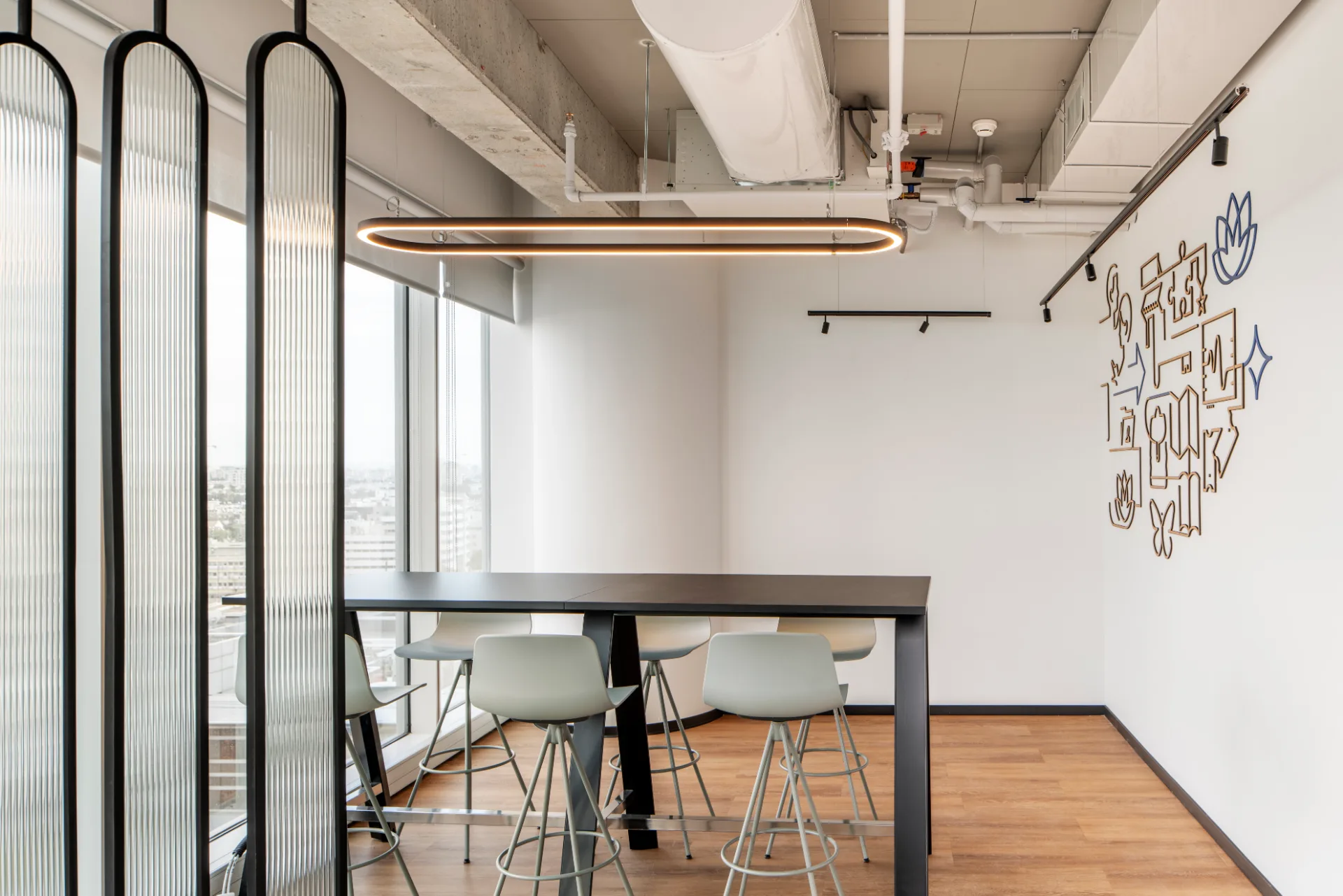 Standing-height meeting nook with a ring pendant