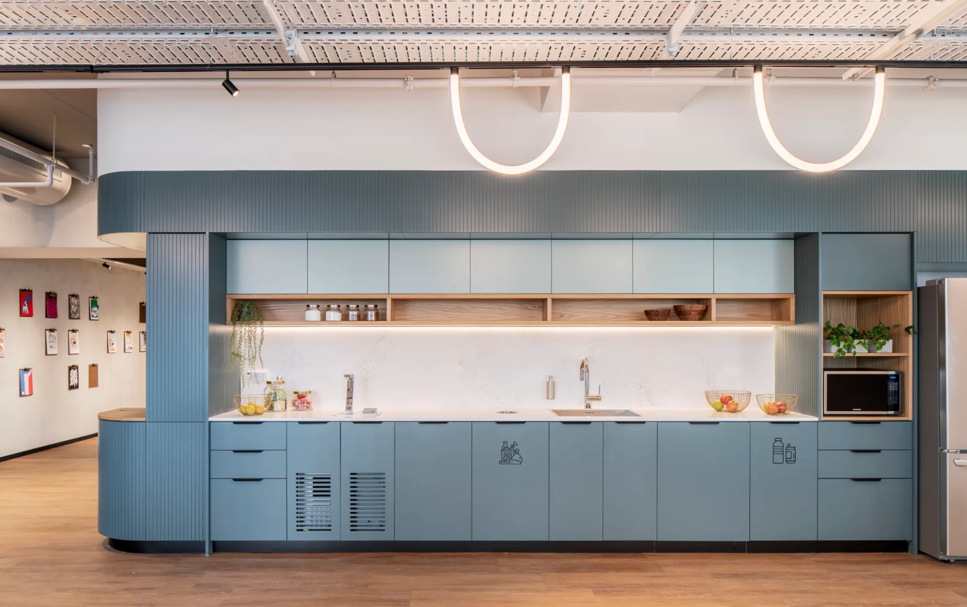 Blue kitchenette with ring pendant lights