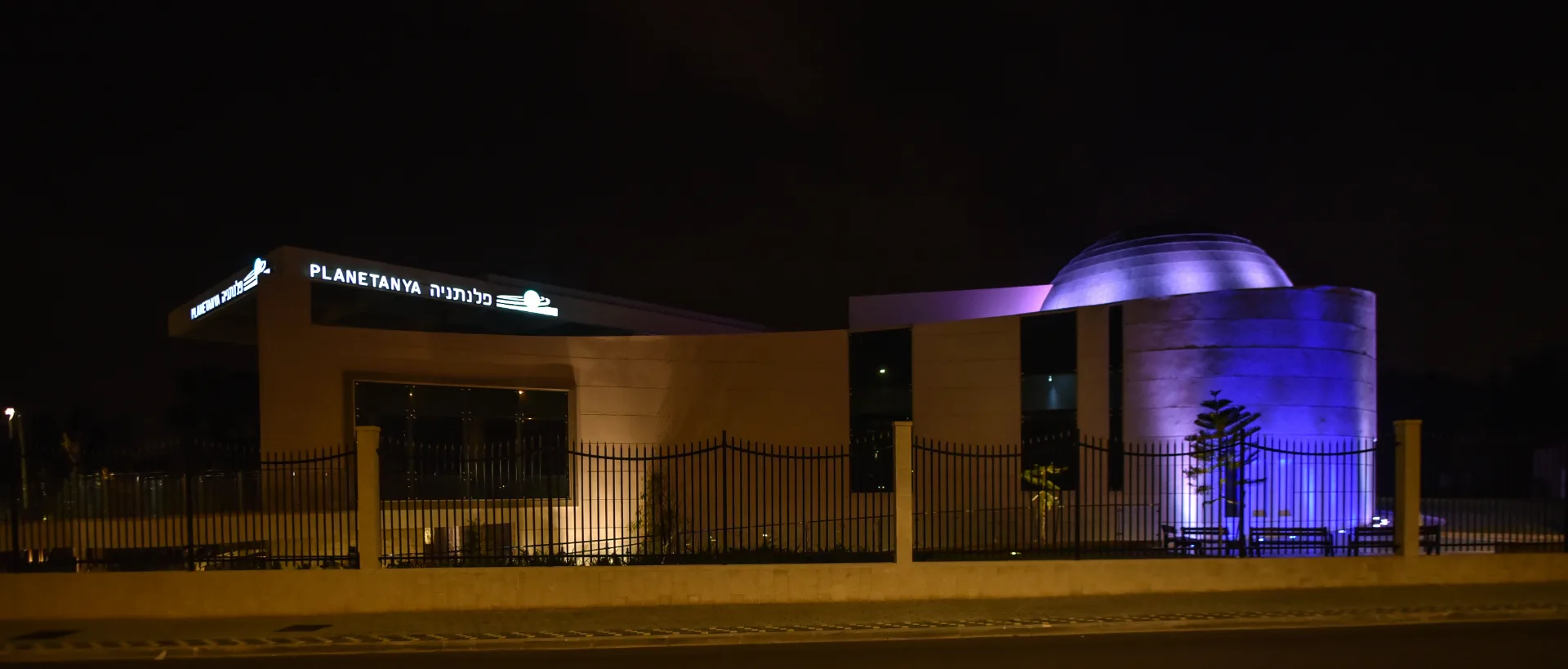 The Planetanya building at night
