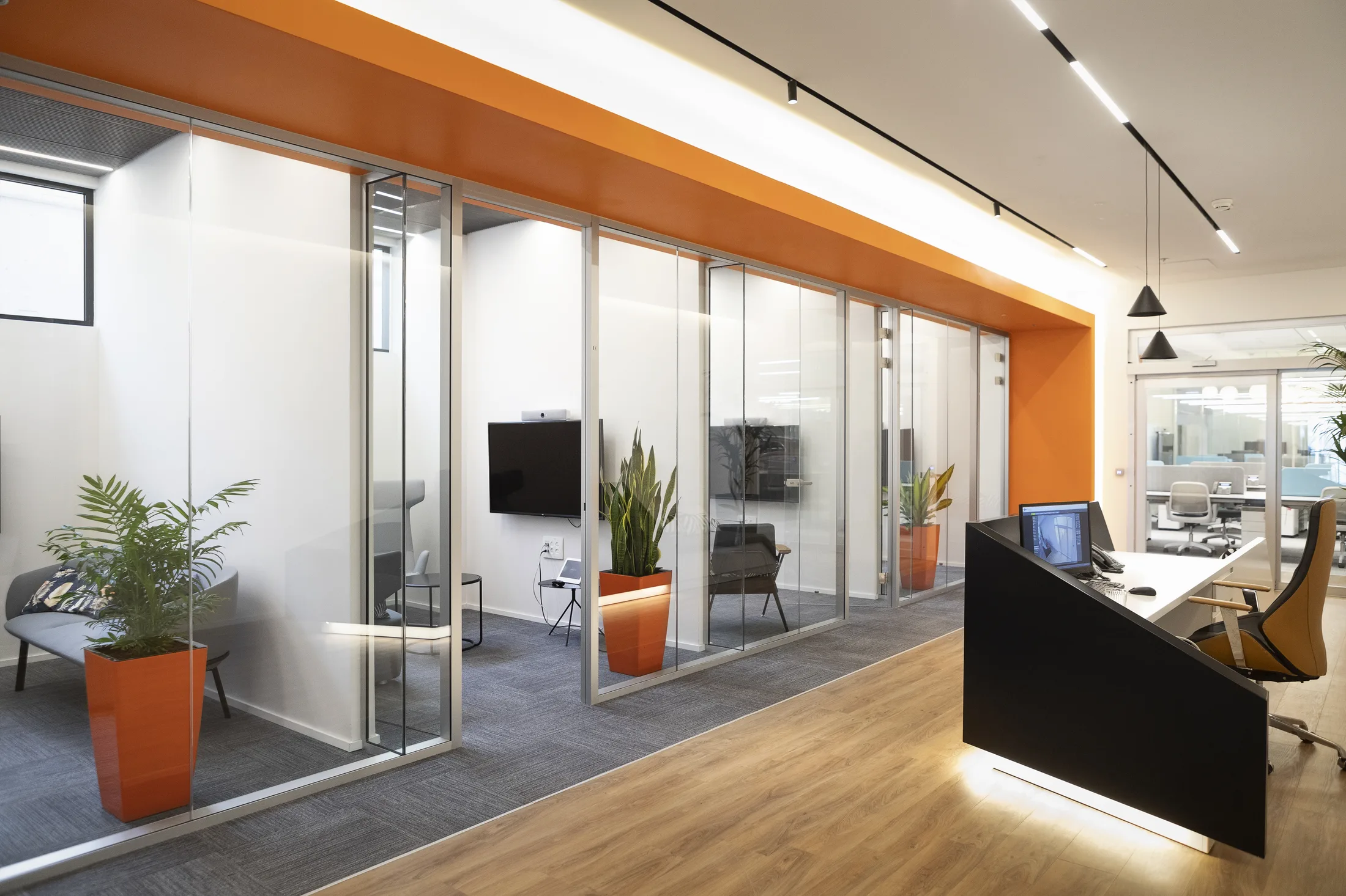 Reception and glazed booths with orange accents