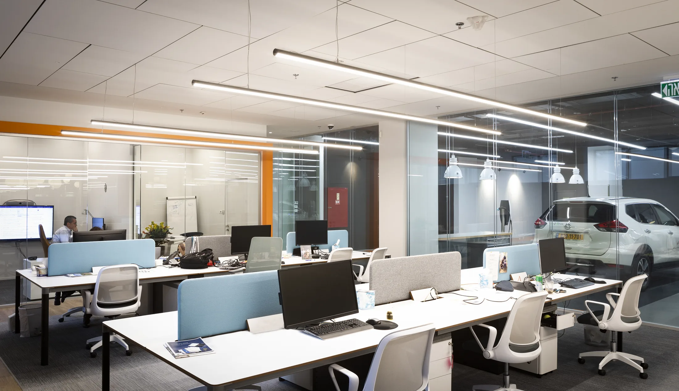 Open workstations beside the glazed vehicle lab