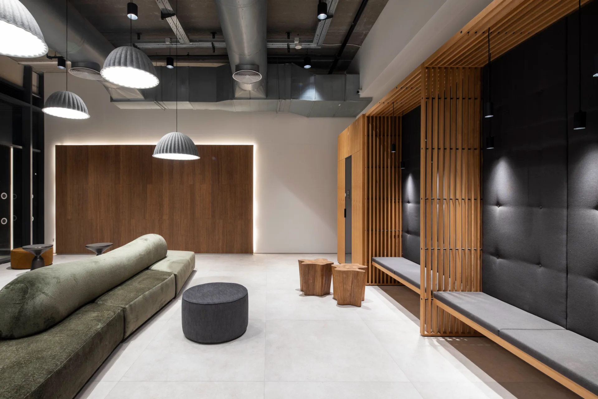 Lobby with a timber-slatted feature wall and soft seating