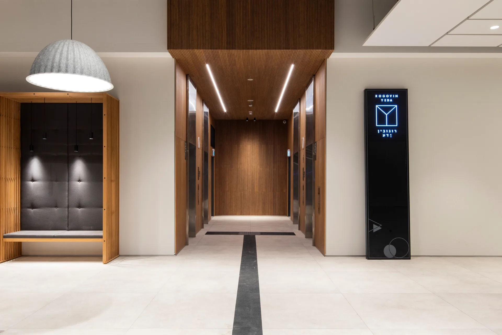 Elevator lobby with linear ceiling lighting
