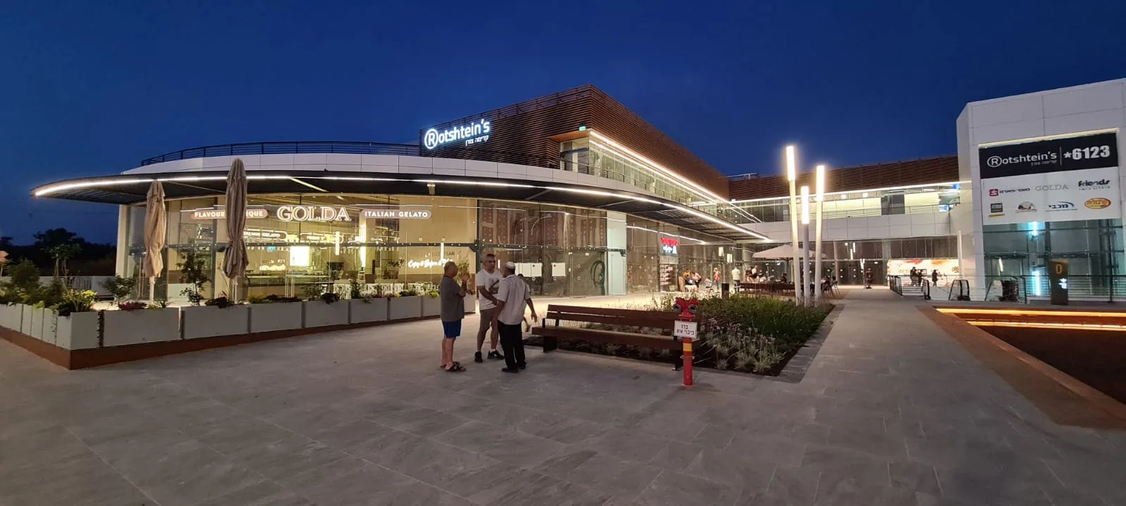 Rotshtein’s signage and canopy lit at night