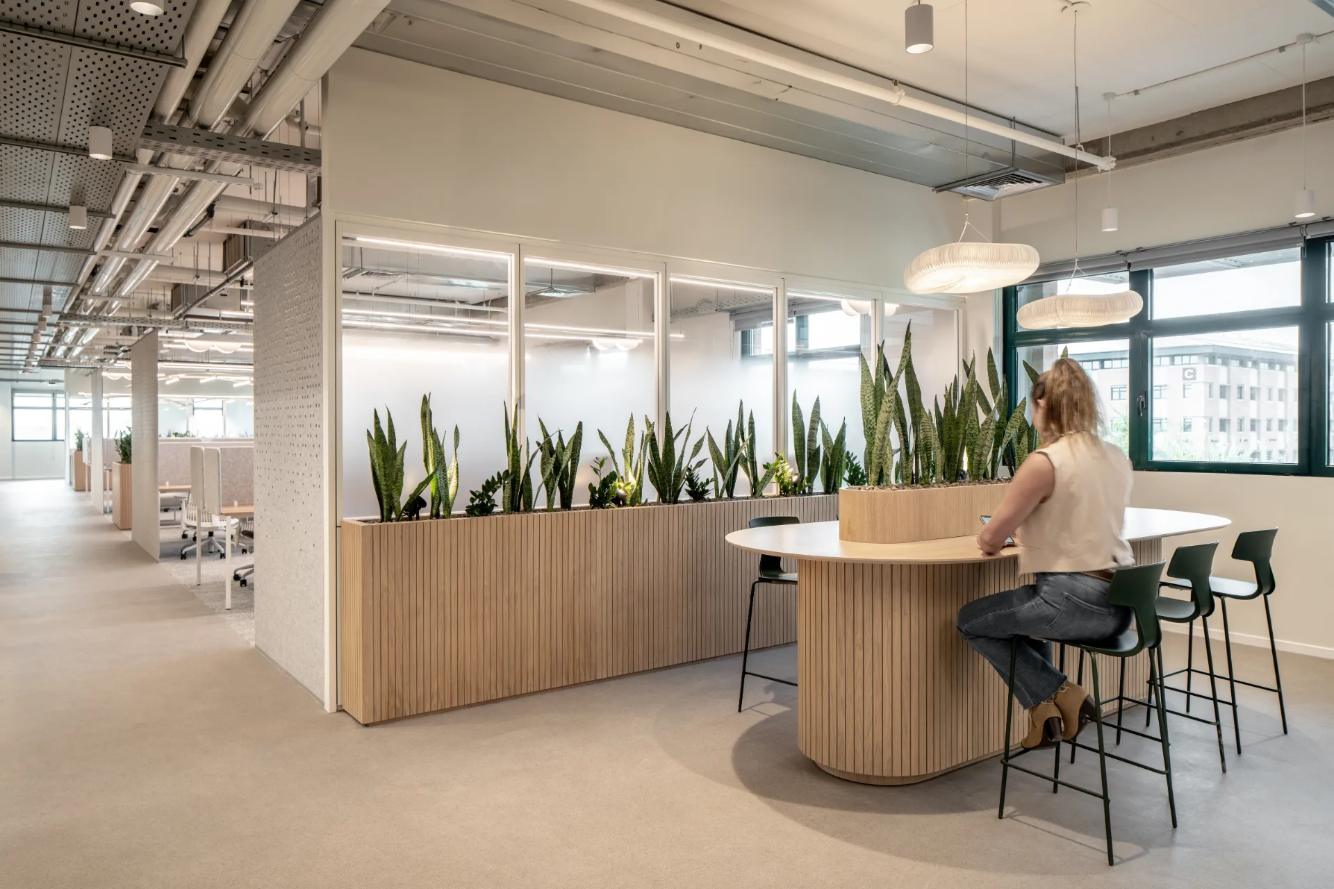 Curved work nook beside a coffee point
