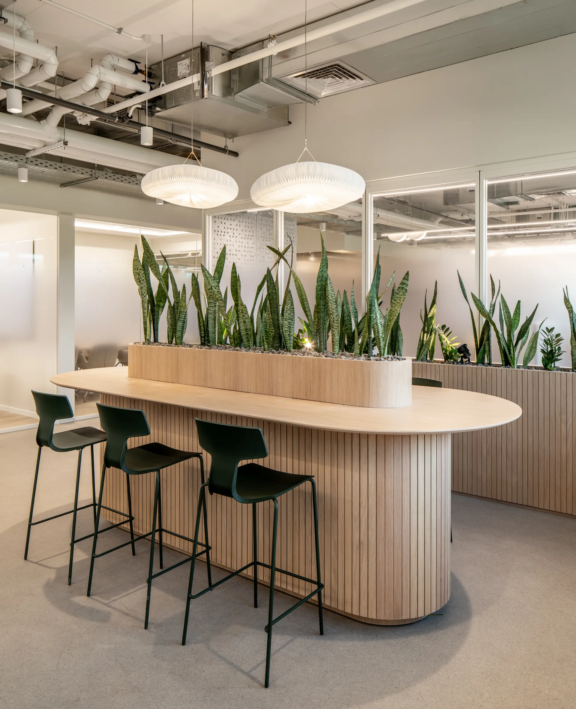 High oval island table with an integrated planter