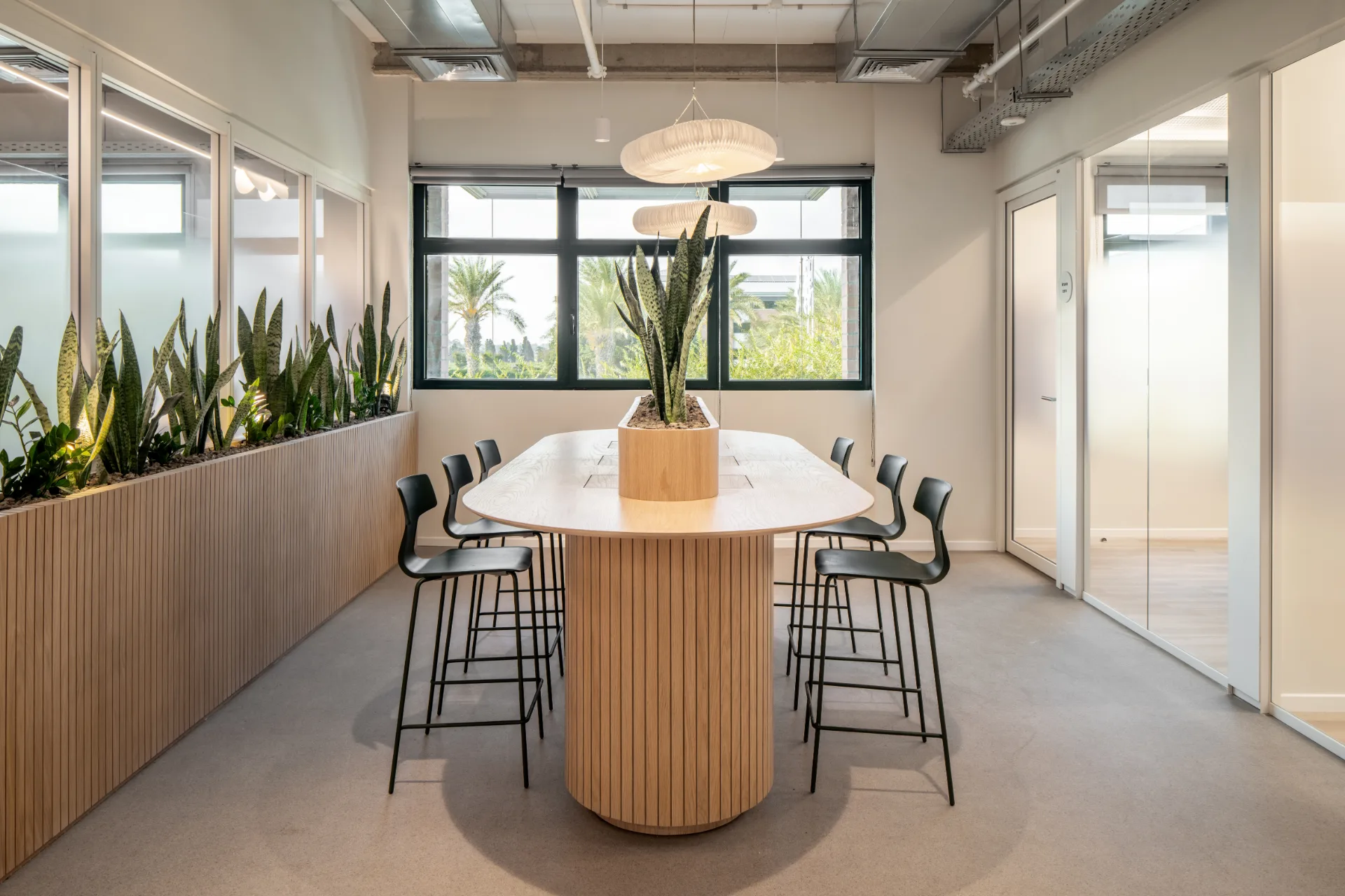 Boardroom with a timber table and a pendant fixture