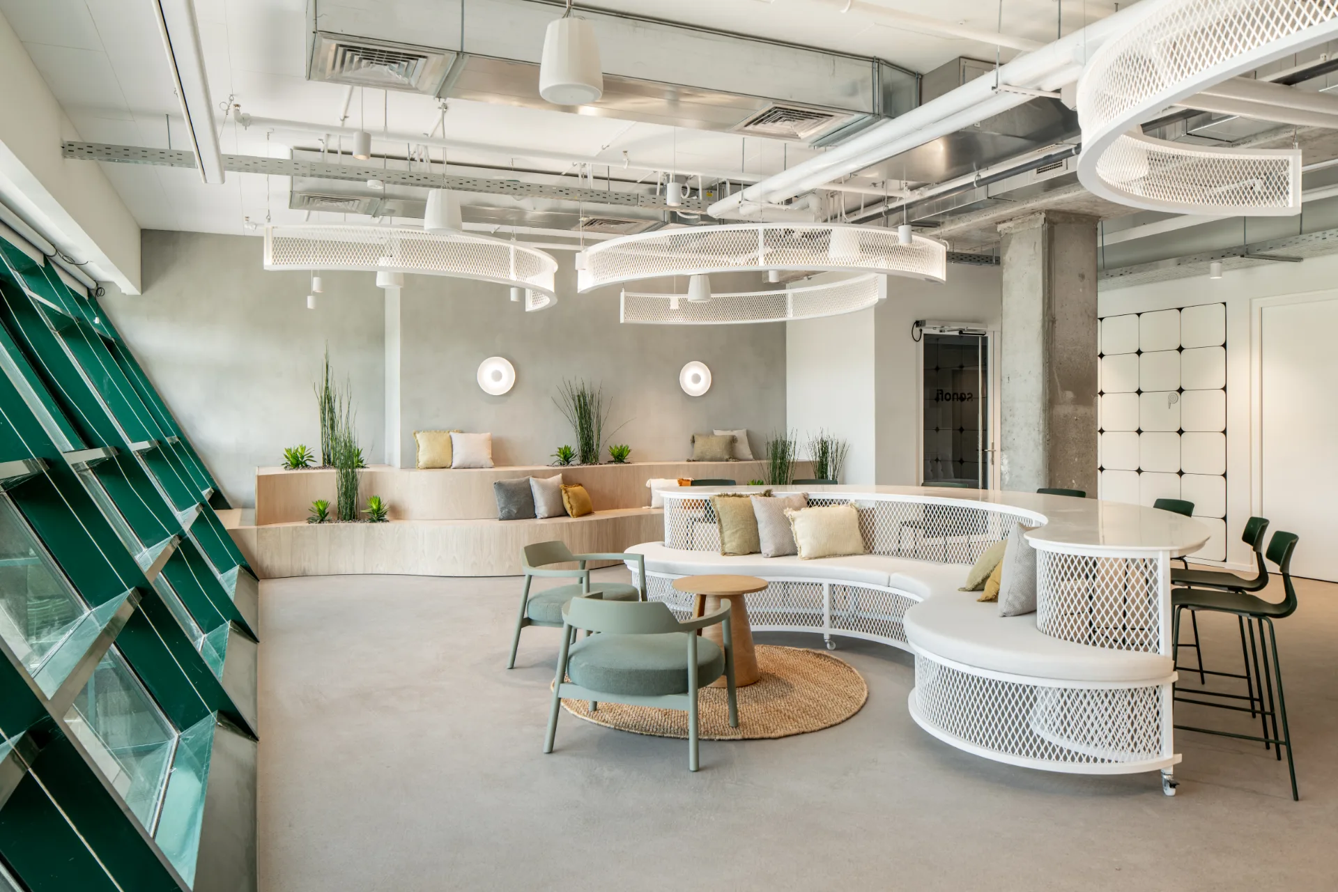 Green lounge with a curved white screen