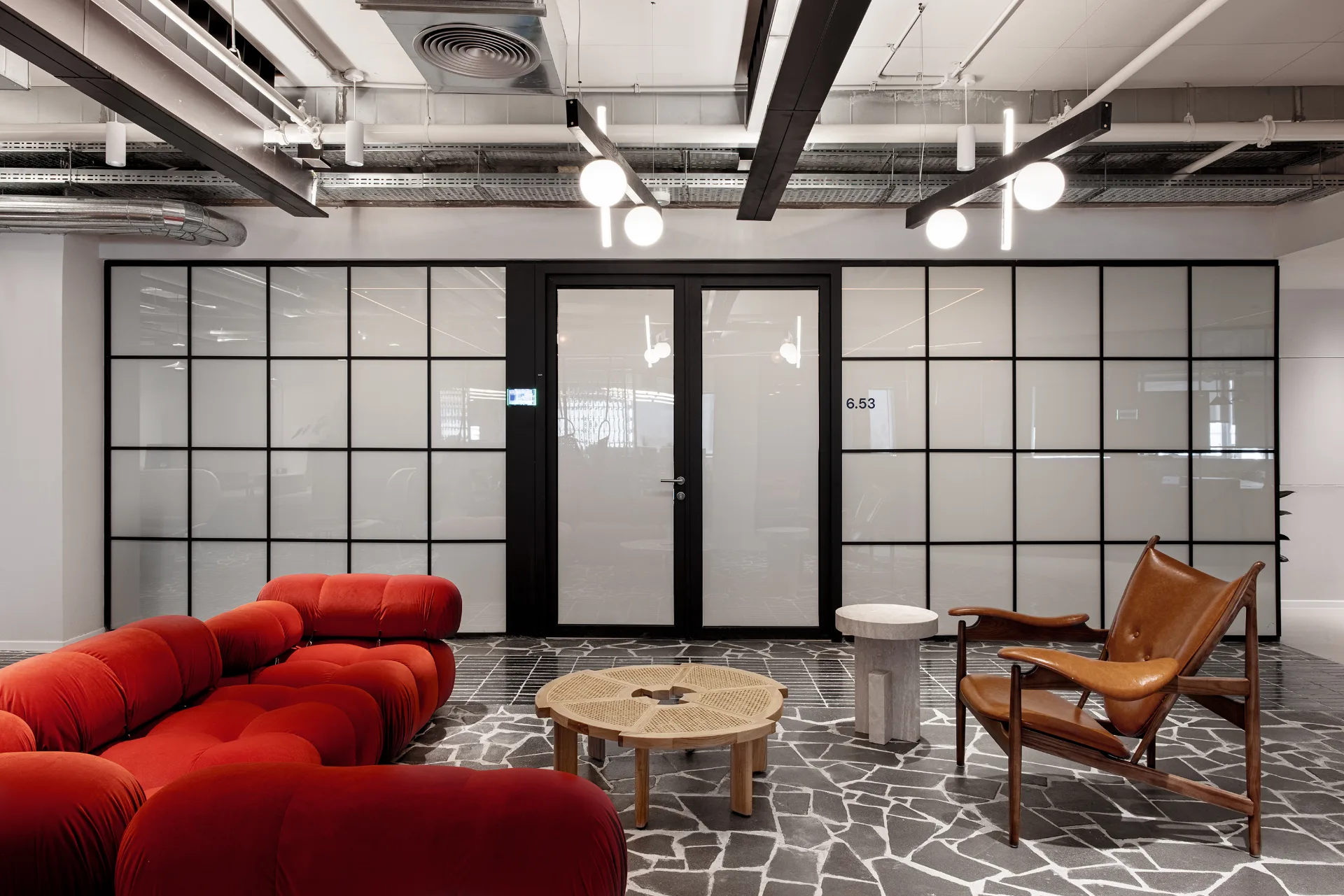 Lounge meeting room with a grid-glass wall