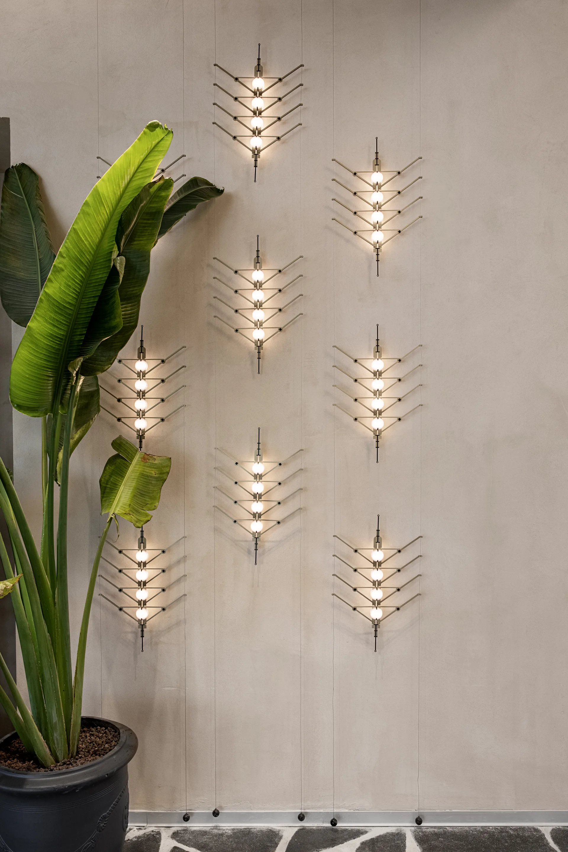 Decorative lighting feature wall with greenery