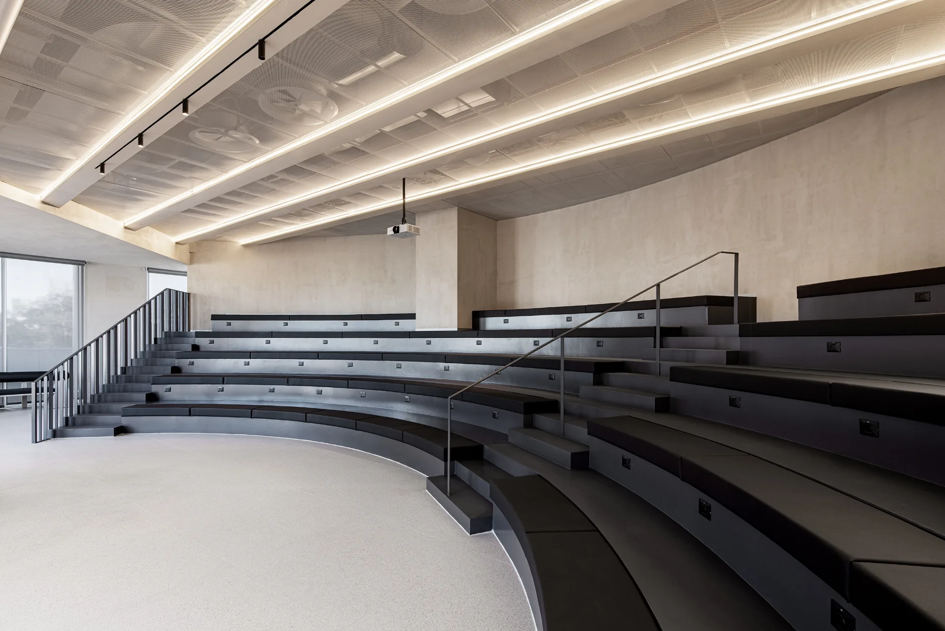 Tiered auditorium with timber cladding
