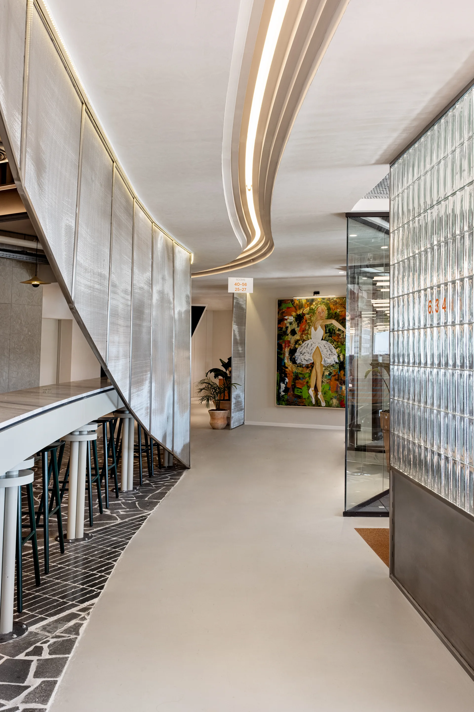 Feature stair and atrium with an art wall and glass block