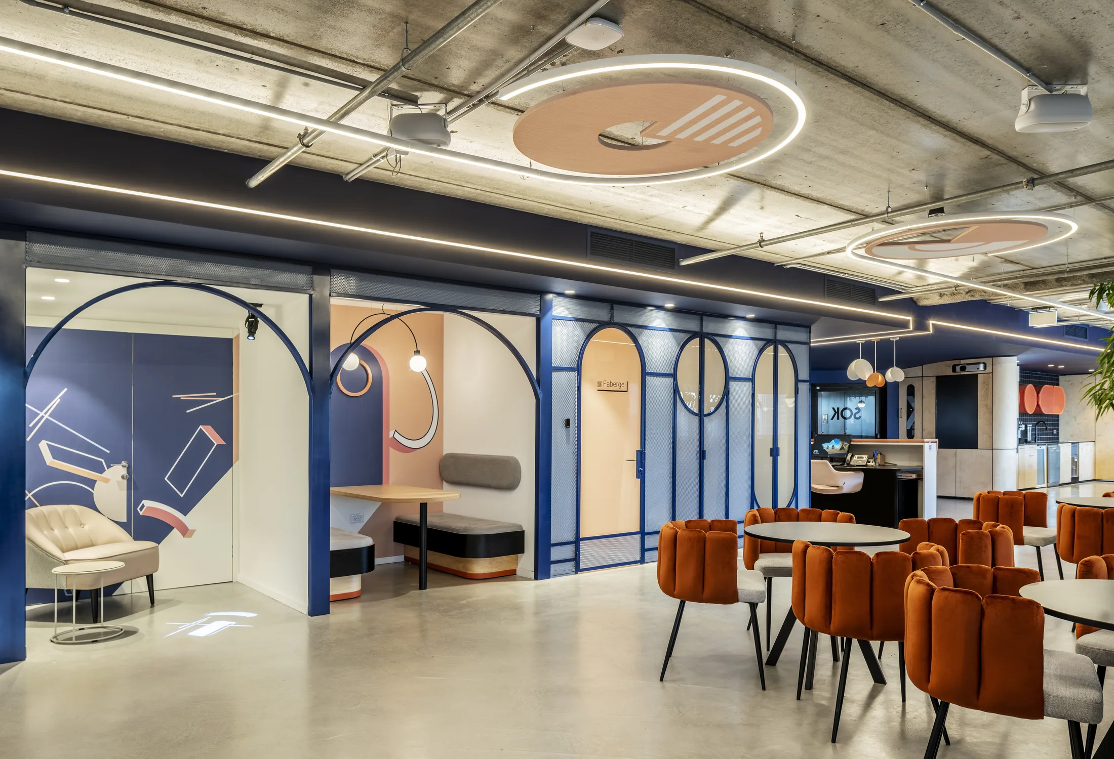 The café with disc ceiling features and branded booths