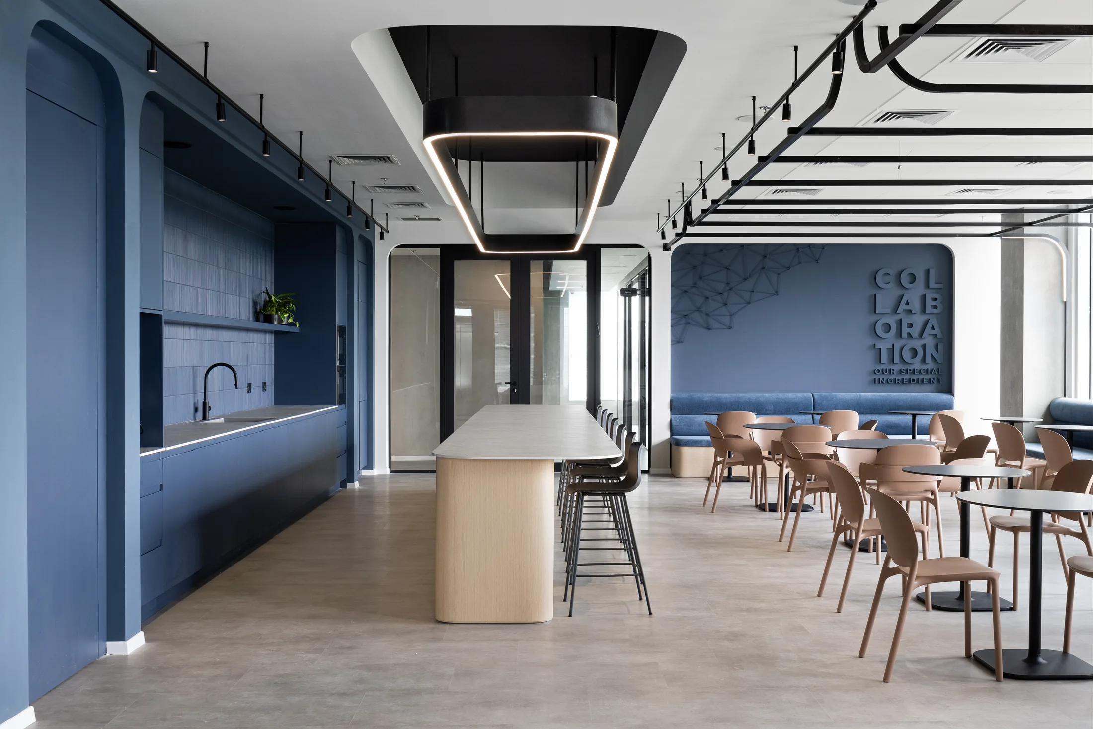 The café with a hexagonal pendant feature and a collaboration wall