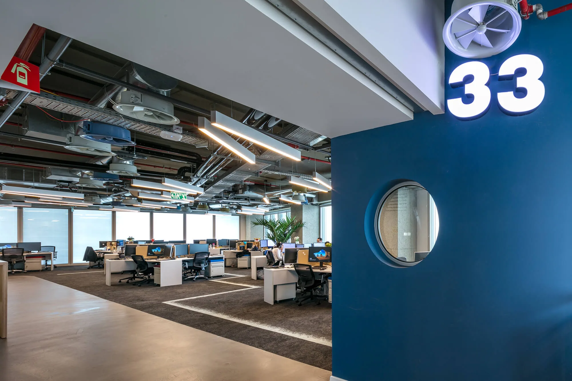 An open work zone marked '33' with linear lighting overhead