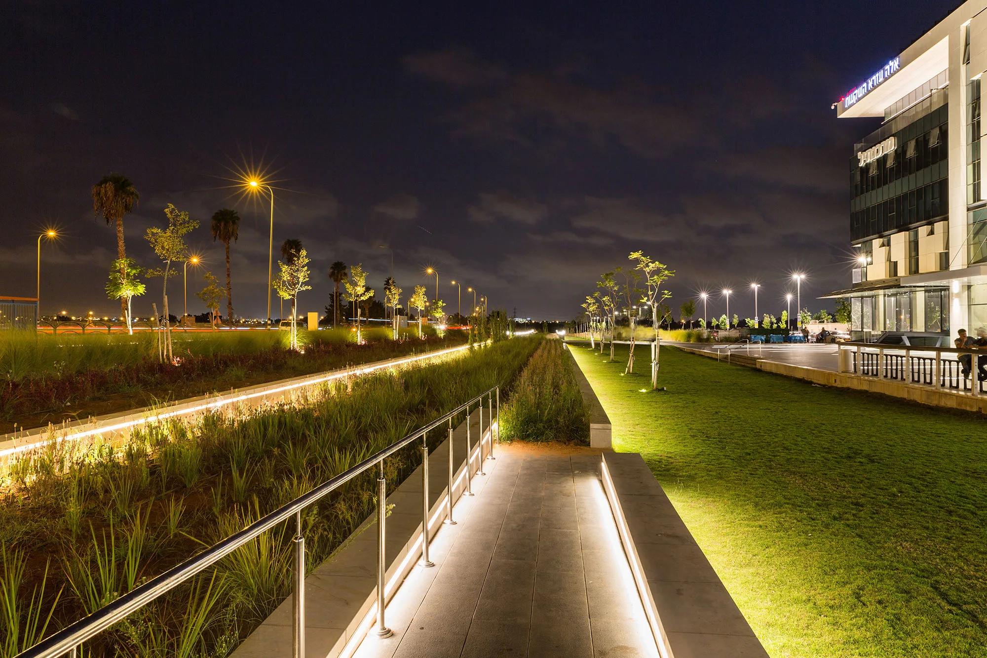 Illuminated pathway in the outdoor development