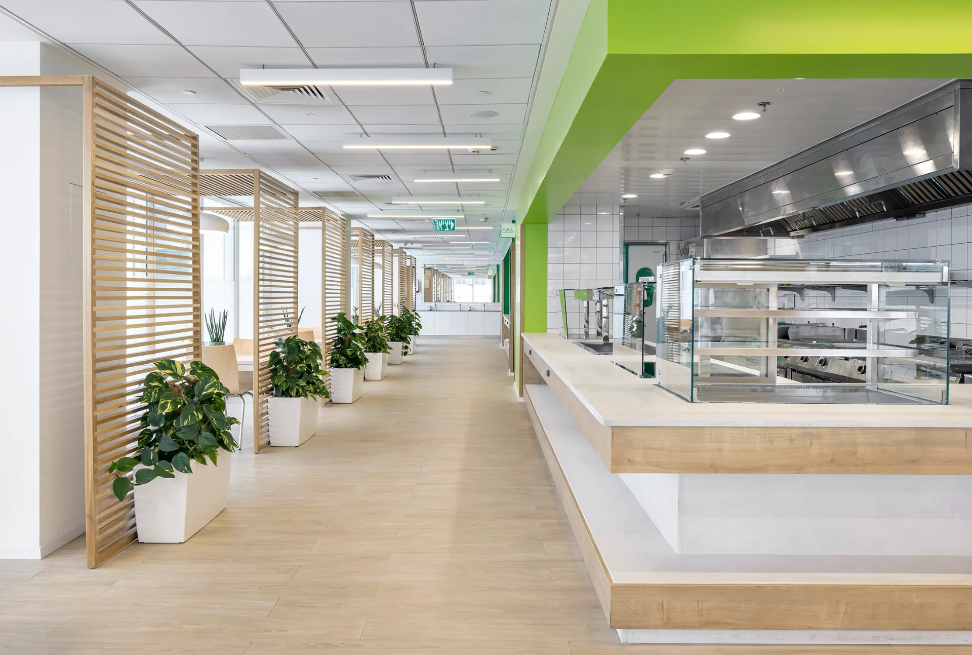 Bright circulation corridor with linear ceiling lighting