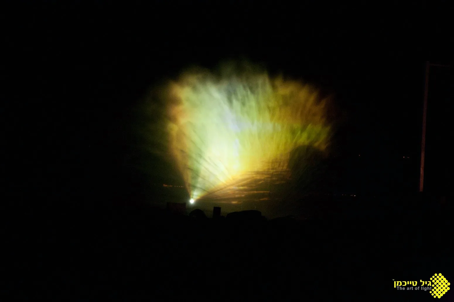 Video projection mapped onto a screen of water mist