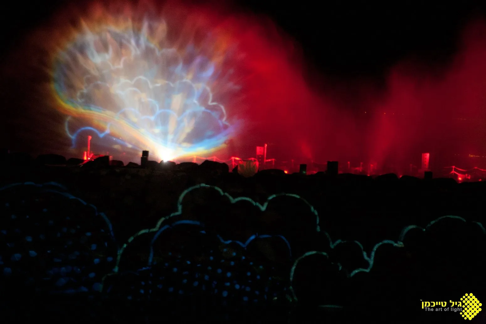 Colorful imagery projected onto the water and breakwater