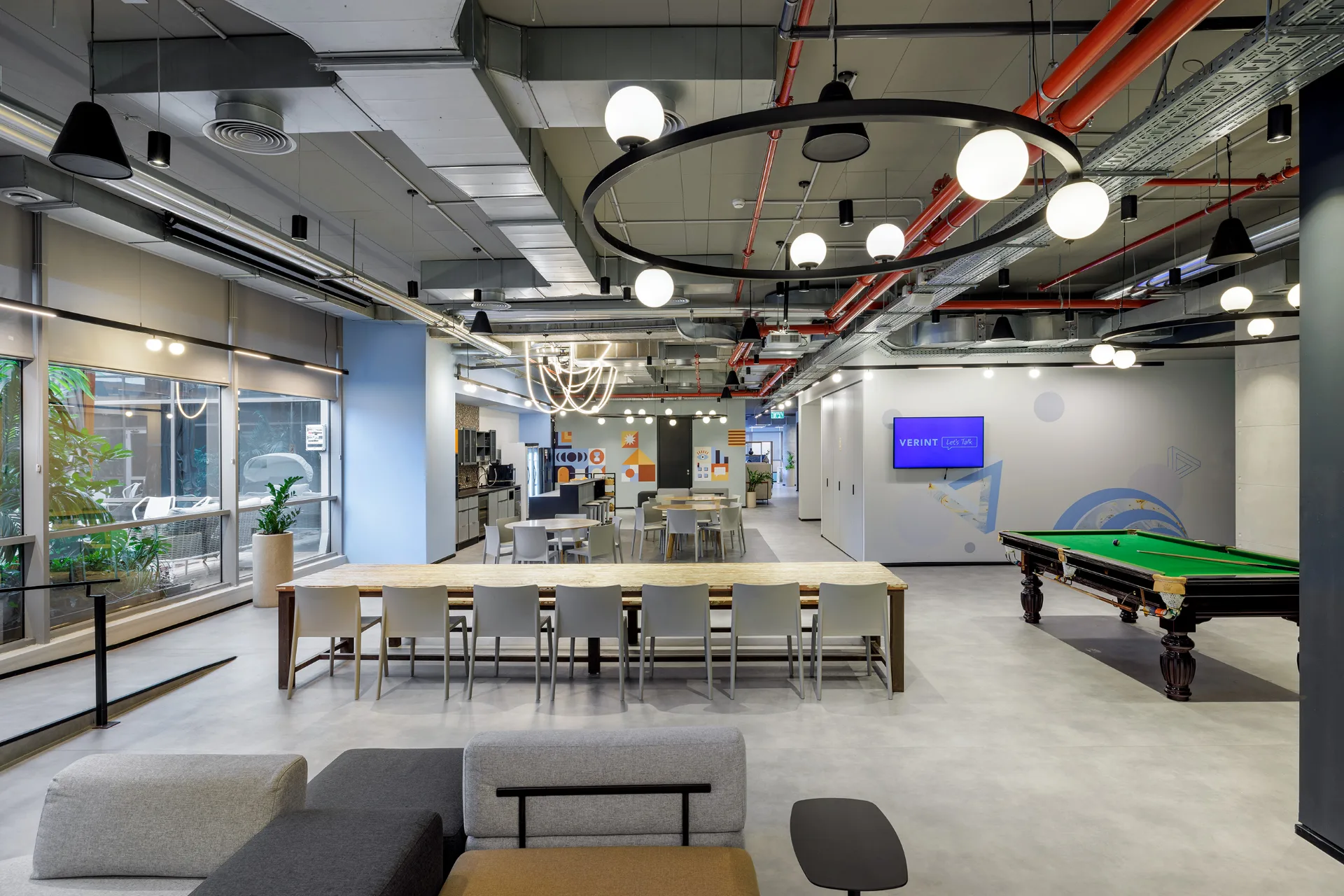 Open work area beside glazed offices