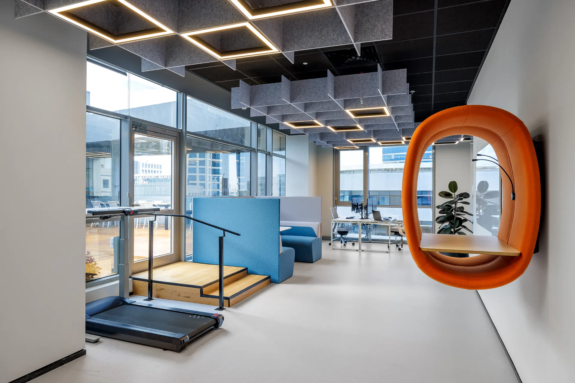 Lounge with colourful seating and city views
