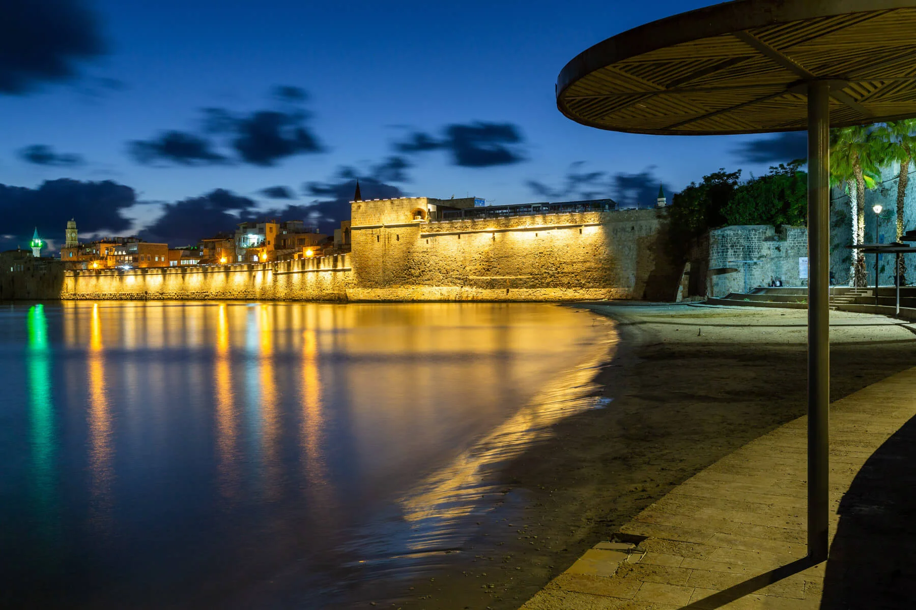 Acre's sea walls at blue hour