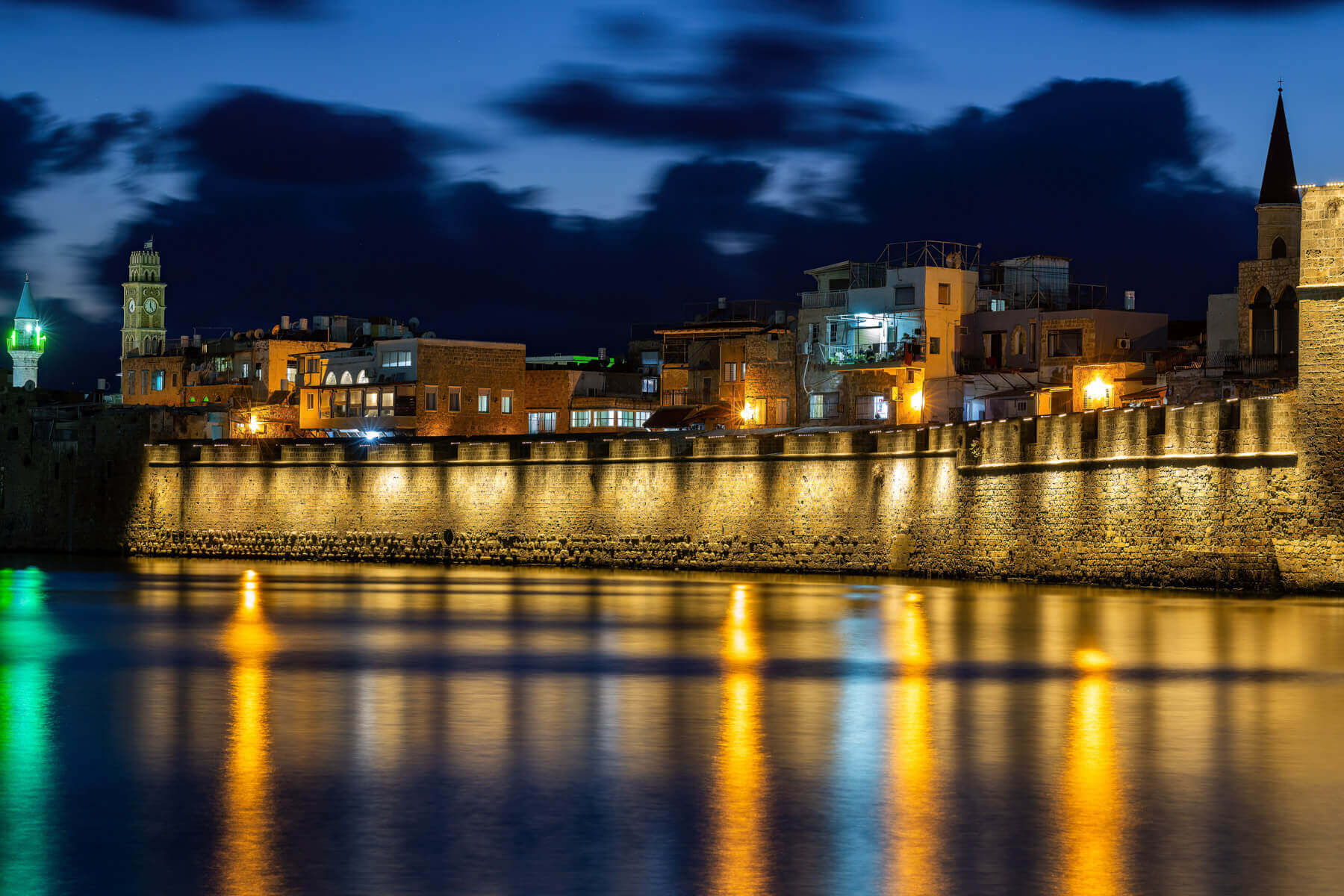 Illuminated walls reflected in the sea
