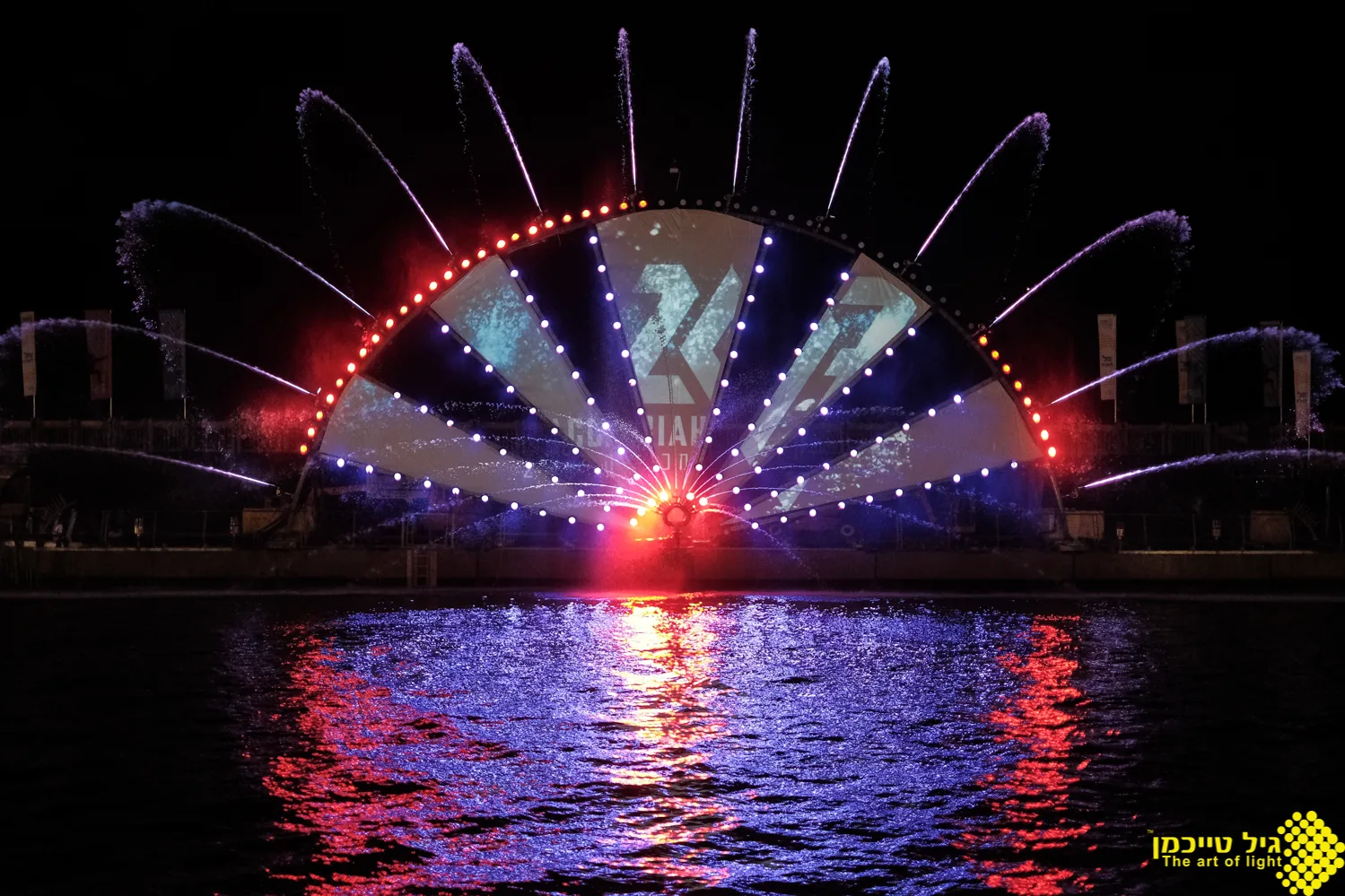 A radial finale of water jets and color light