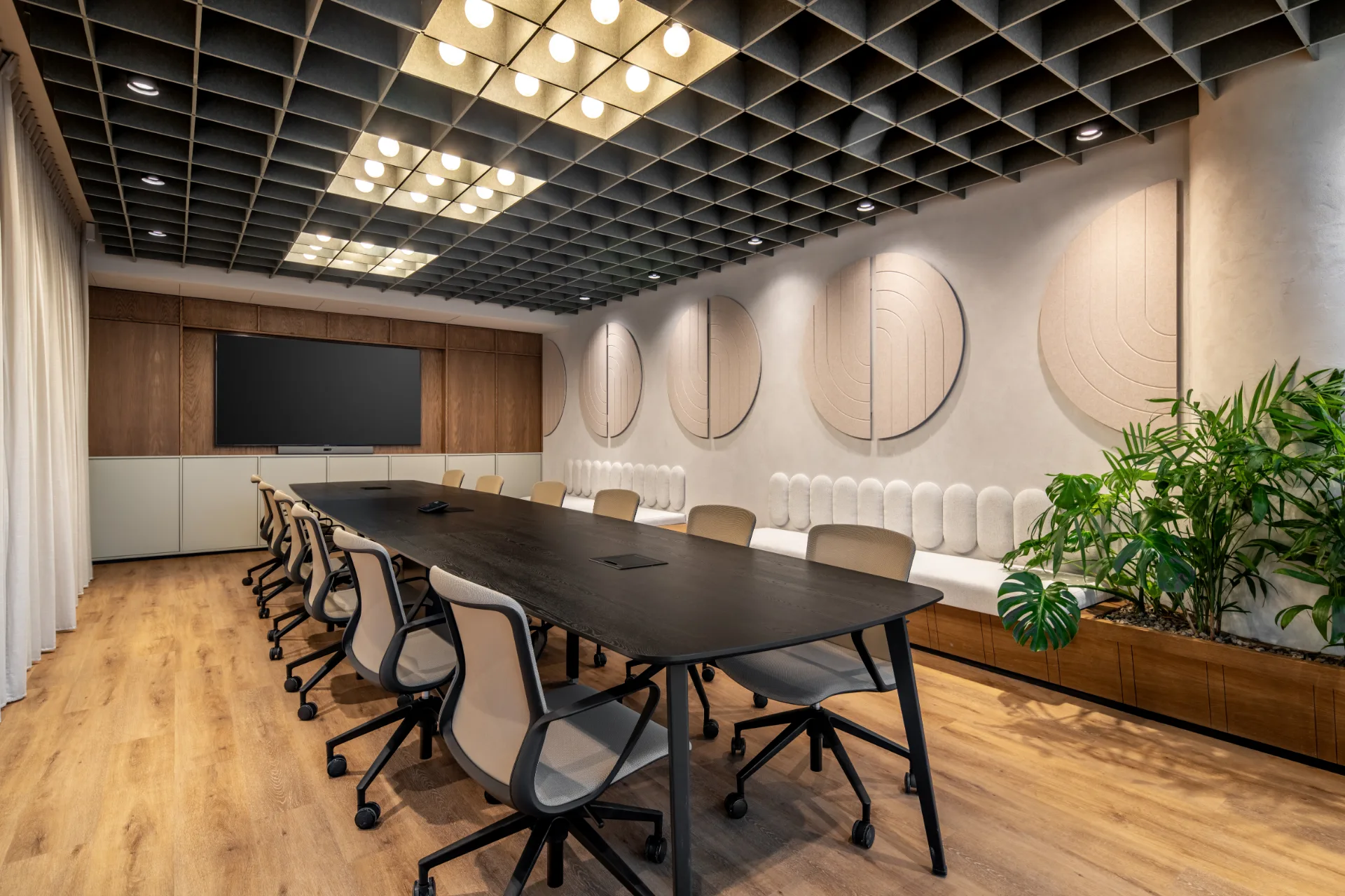 Boardroom with a long table and acoustic wall panels