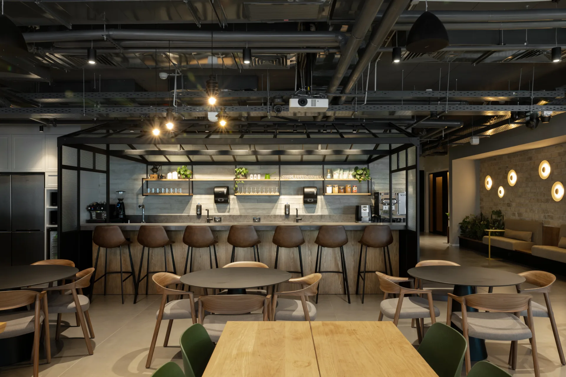 Café and kitchen bar beneath a steel canopy