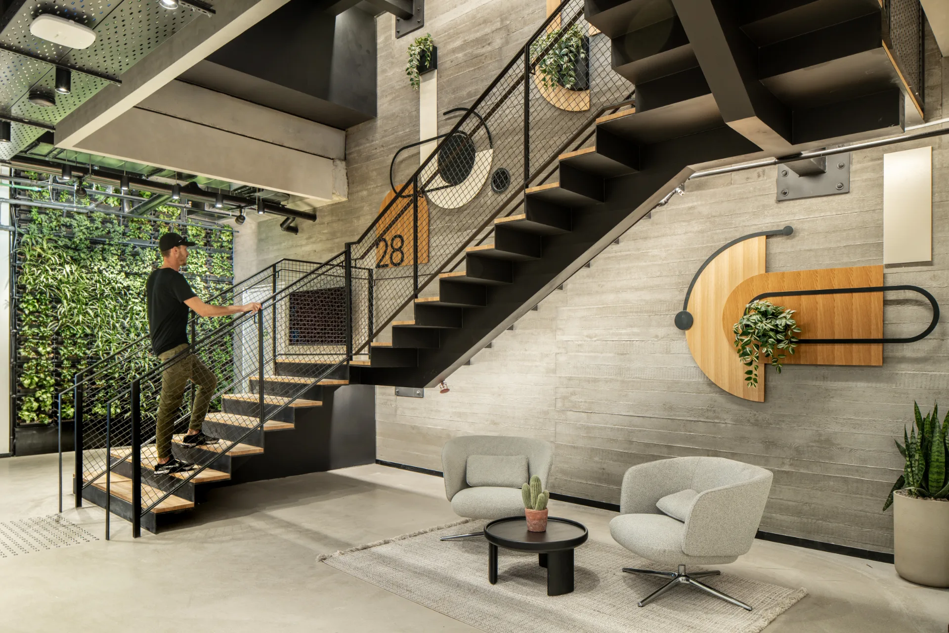 Internal stair with lounge seating and planting