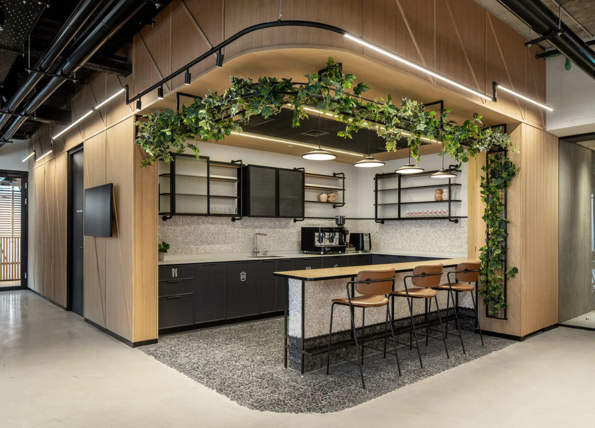 Kitchenette with a greenery arch and linear lighting
